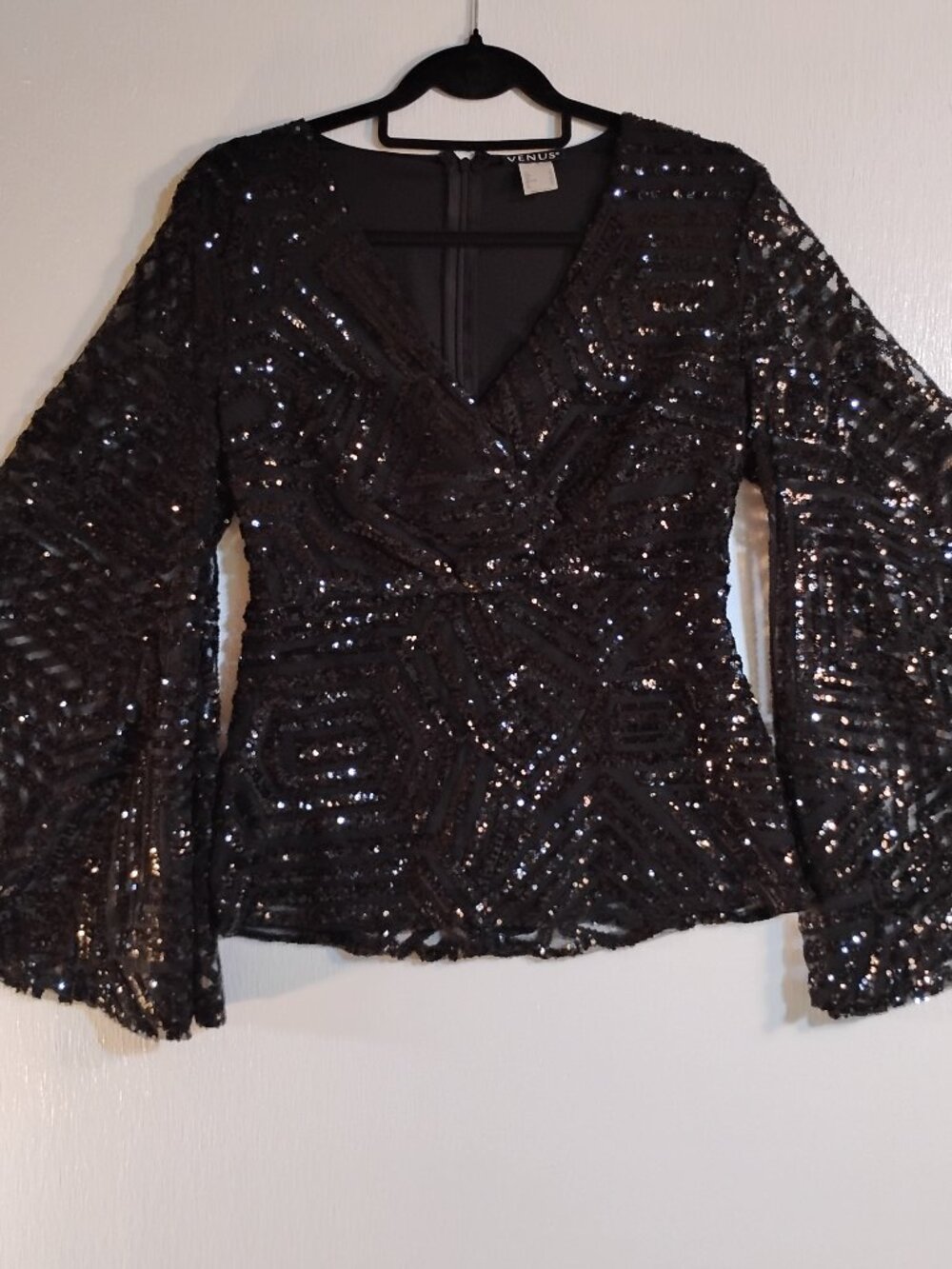 Black sequin V-neck top with dramatic bell sleeves by Venus, size 6.